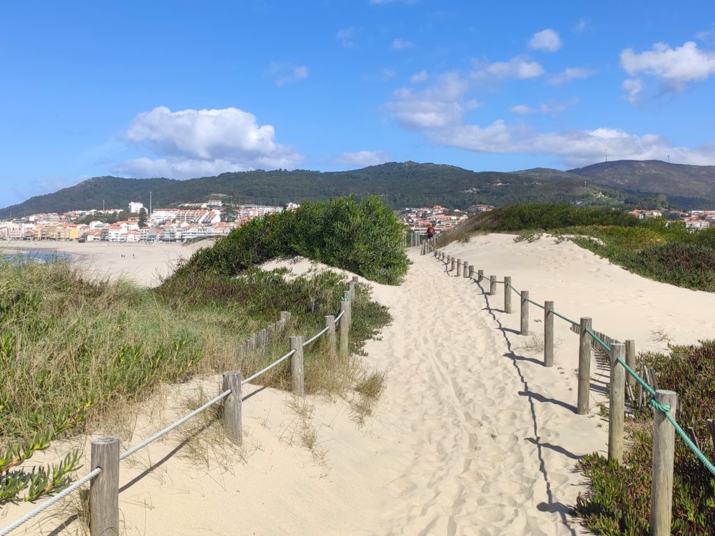 The wooden platform covered in sand